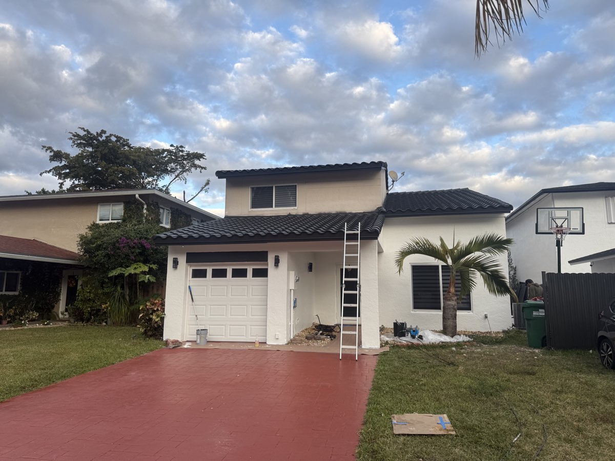 Exterior painting in progress on a home in The Hammocks Miami